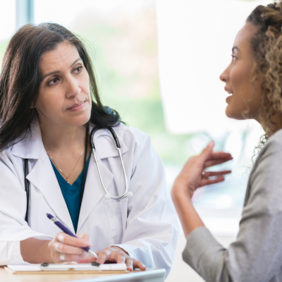 A doctor talking to a patient, representing mental illness awareness week