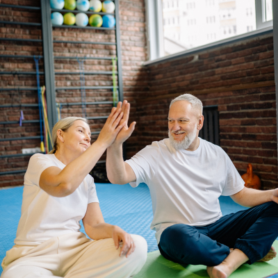 Benefits of physical wellness on mental health 6 Two older adults practicing mindfulness together. Representing benefits of physical wellness on mental health