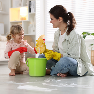 Understanding parenting burnout 3 Mother and daughter cleaning together happily, representing parenting burnout